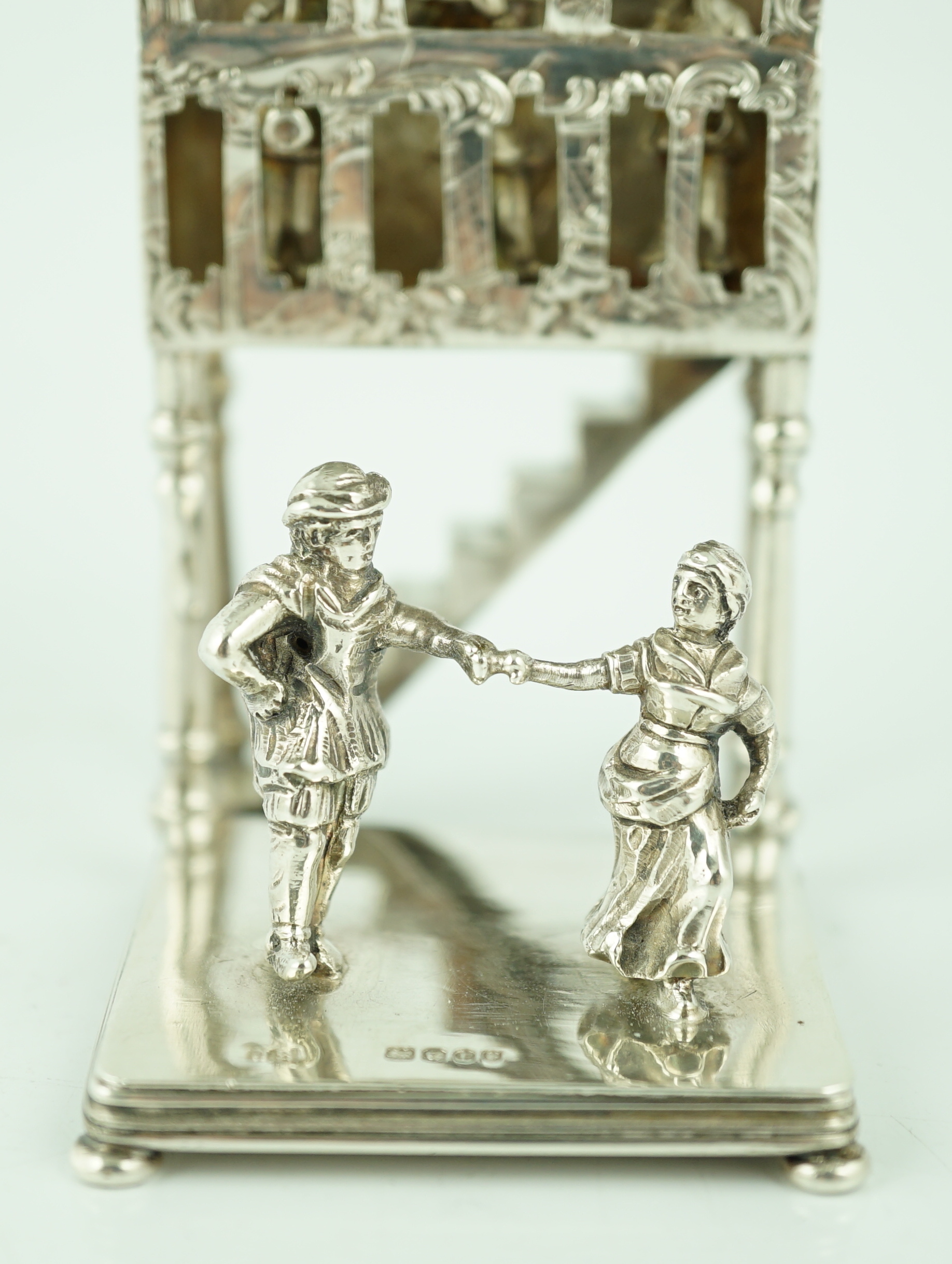 A late 19th century German silver miniature figural group, modelled as two dancers, with three musicians in a band stand, import marks for John George Smith